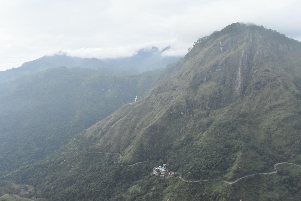 A winding road climbing a mountain through Sri Lanka's hill country