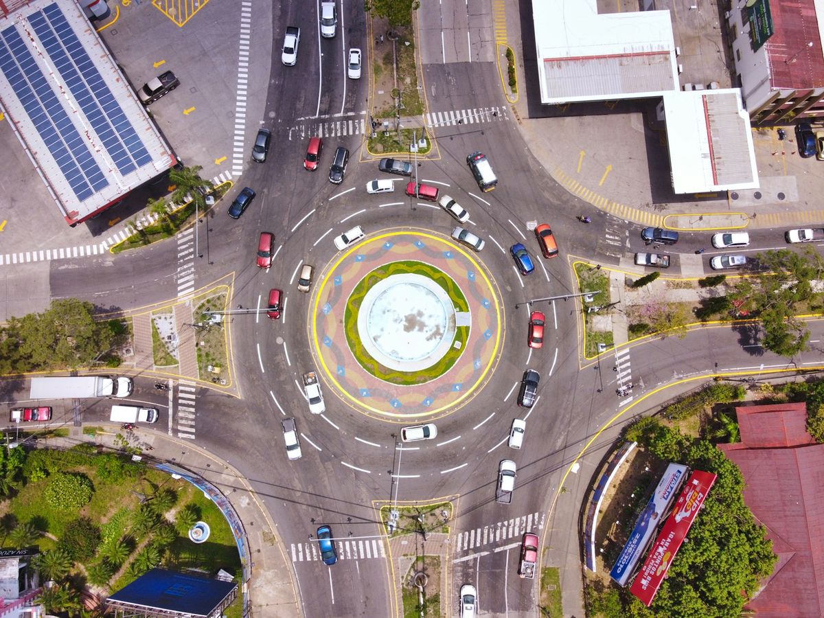 Aerial view of a road roundabout with traffic