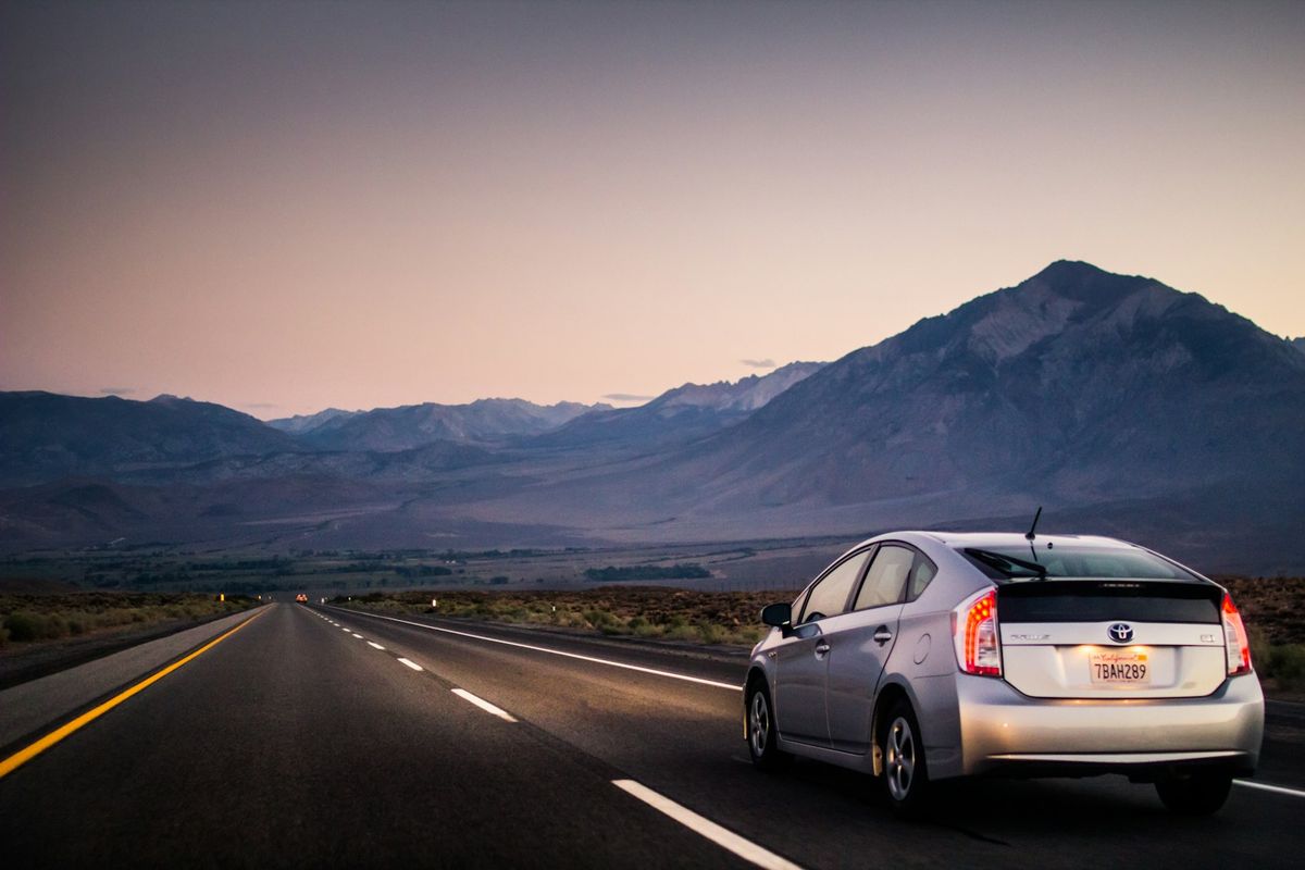 Vehicle driving through an empty open road