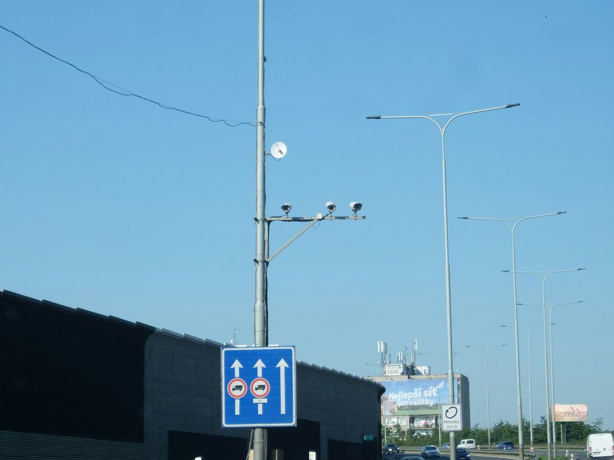 Speed camera and traffic sign on a motorway