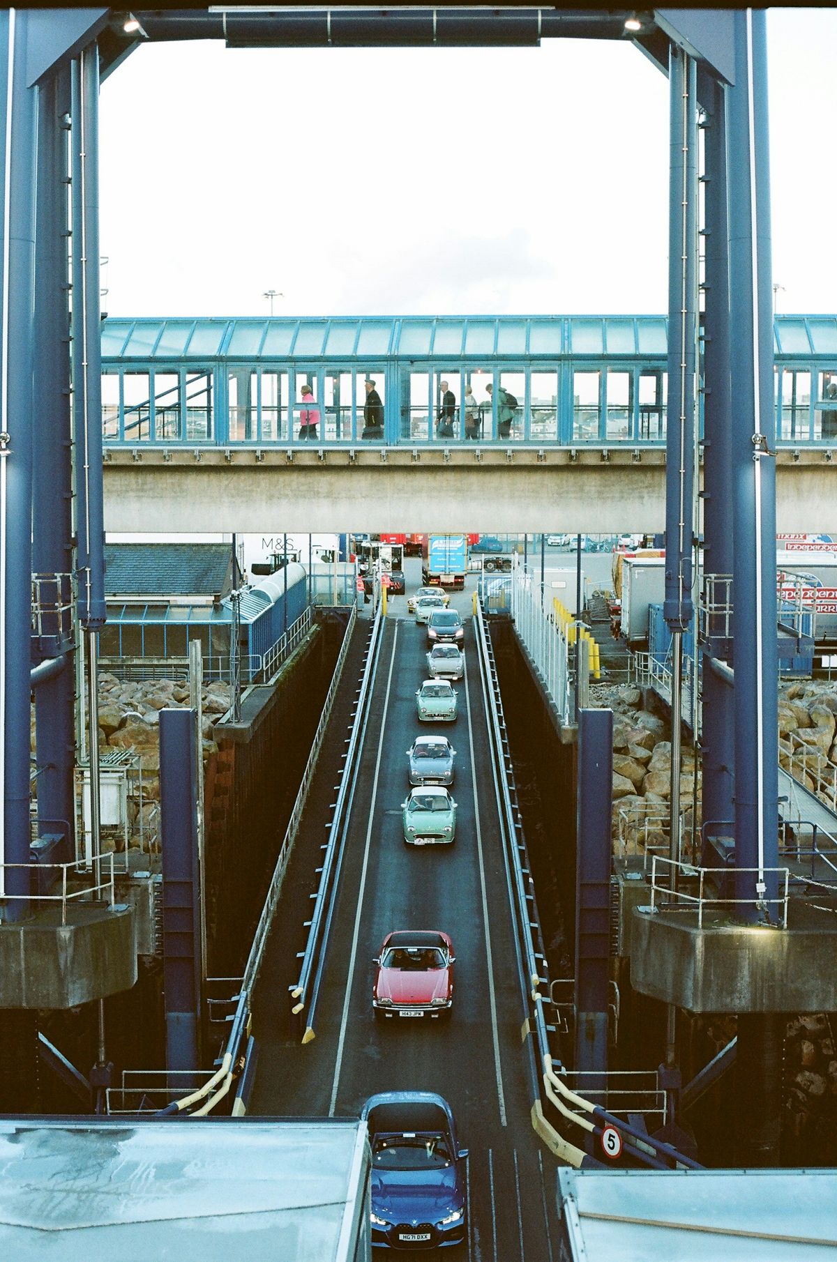 Cars lined up on a ferry ramp boarding the car deck