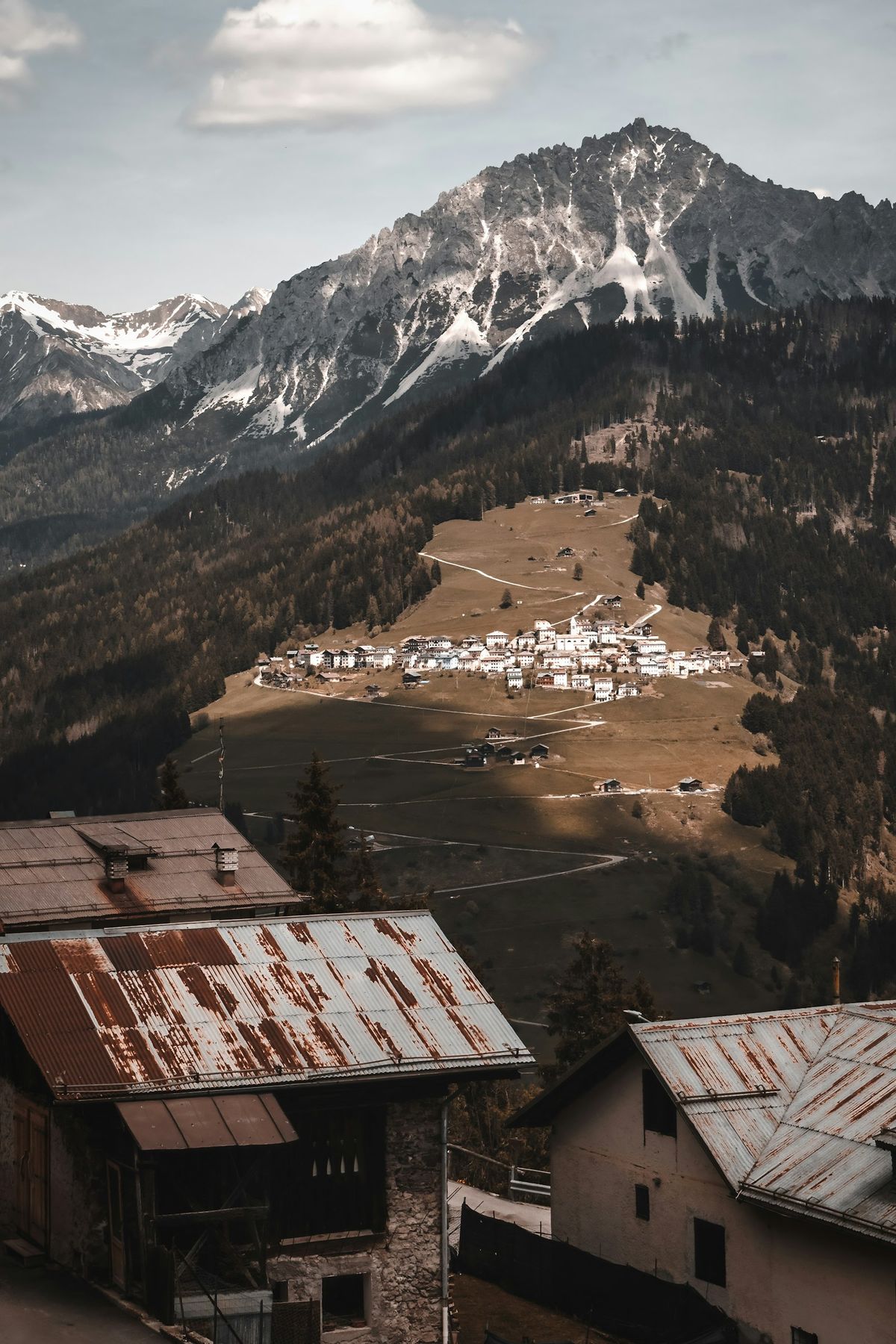 Mountain range with alpine village in the Italian Alps