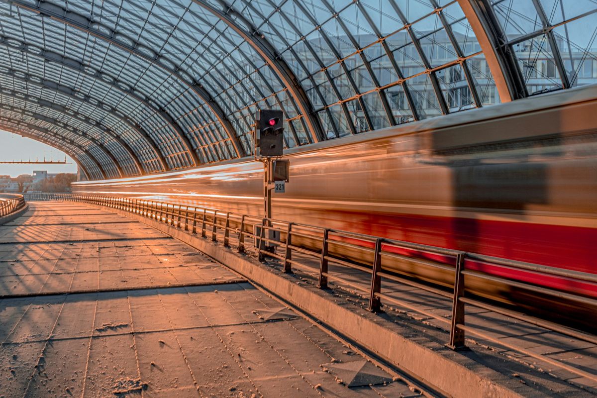 Train traveling through Berlin Hauptbahnhof station