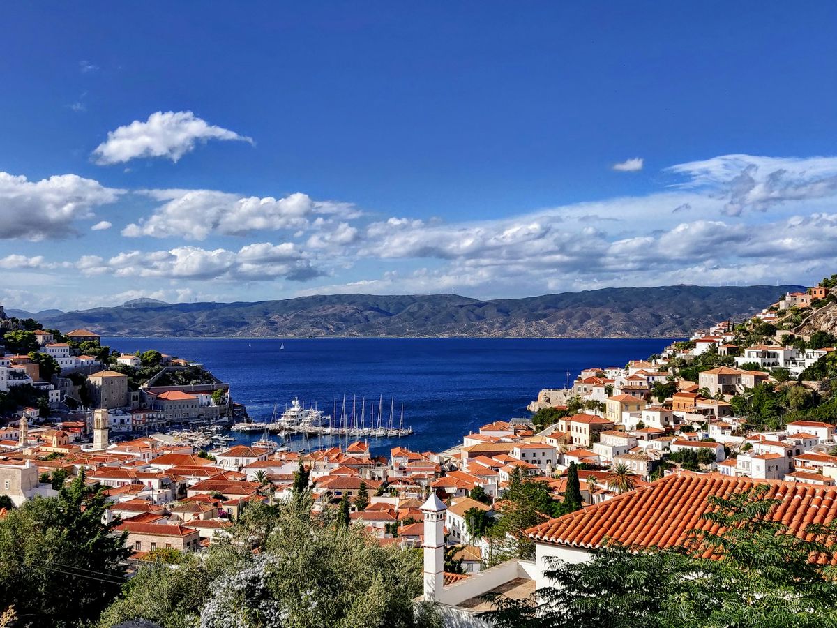 Aerial view of a Greek harbour town on the coast near Hydra