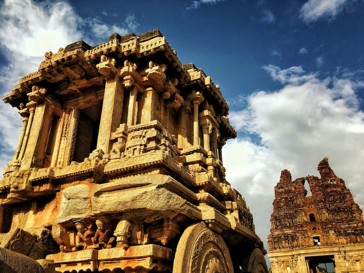 Ancient stone temple ruins among boulders at Hampi, India