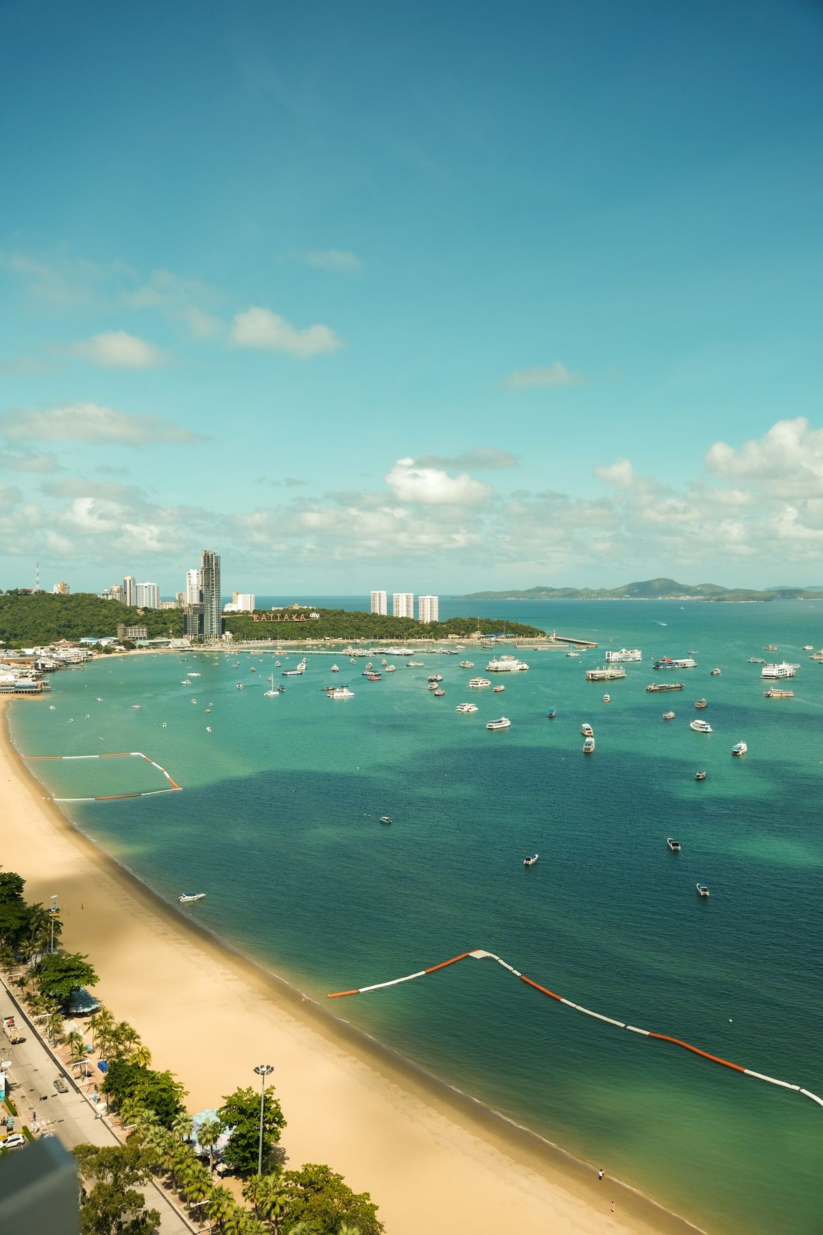 Aerial view of Pattaya Bay with boats and coastal skyline