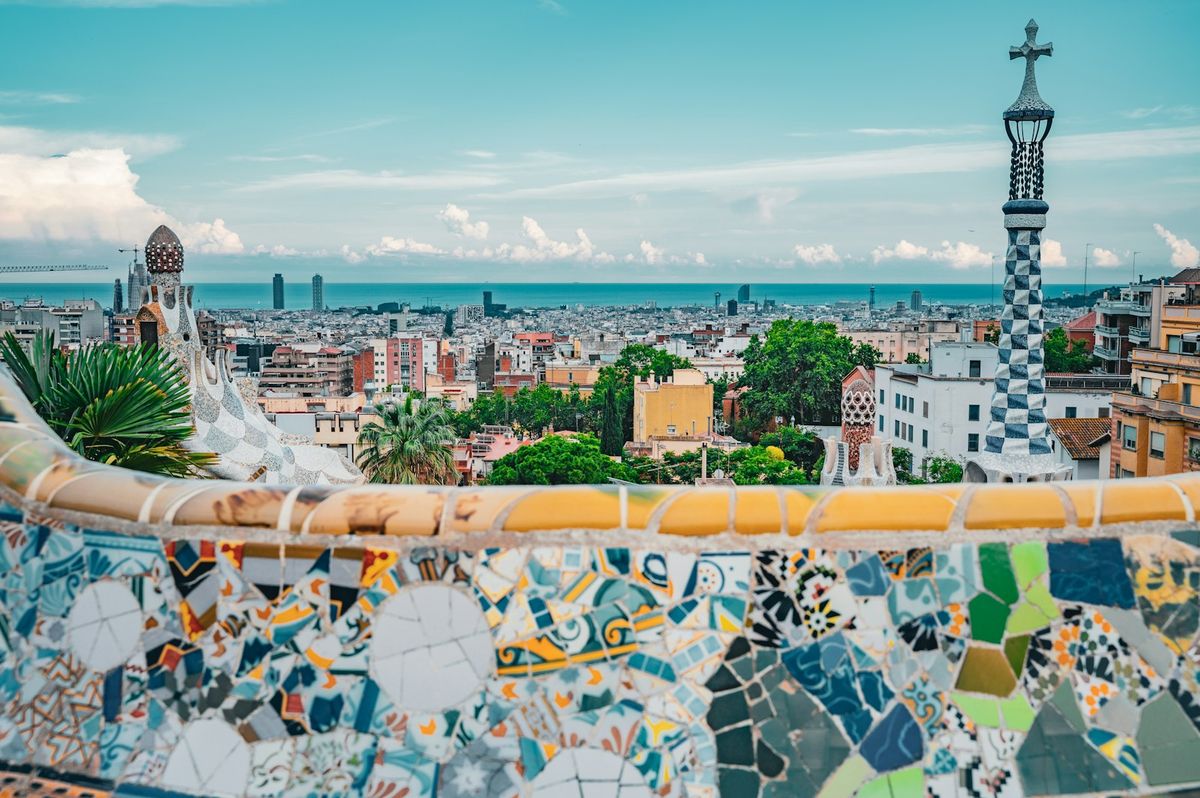 View of Barcelona cityscape from a rooftop with tiled architecture