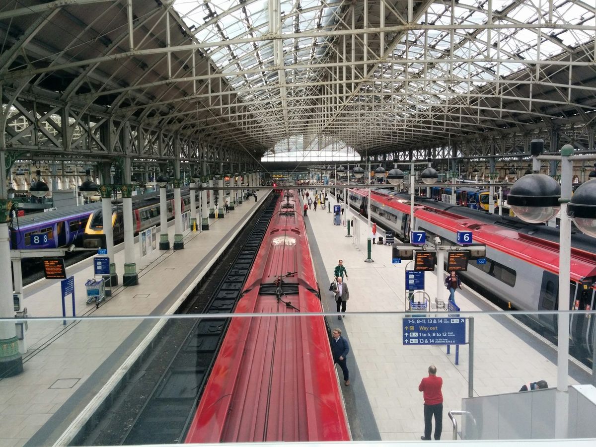 Manchester Piccadilly station with red trains