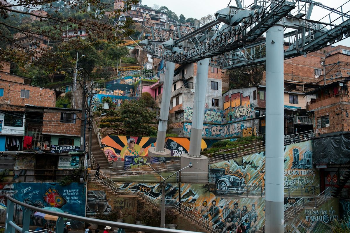 Colorful graffiti murals on a building in Medellin's Comuna 13