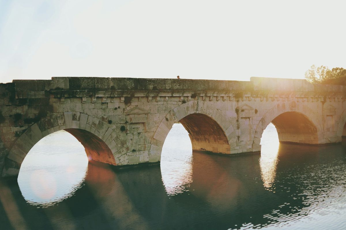 Tiberius Bridge in Rimini bathed in sunlight