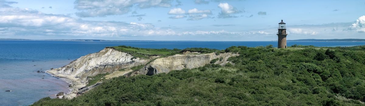 Lighthouse on a hill overlooking the ocean at Martha's Vineyard