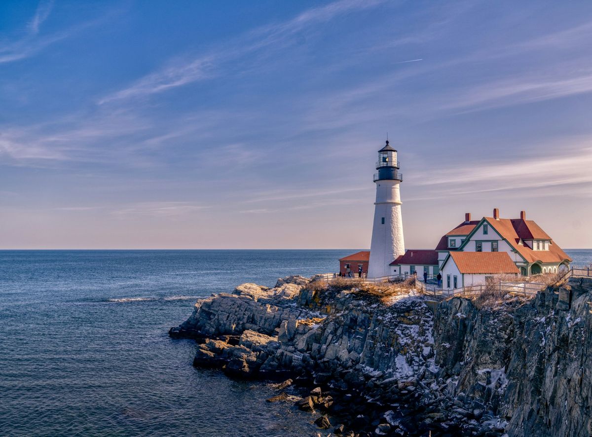 White lighthouse beside the sea in Maine