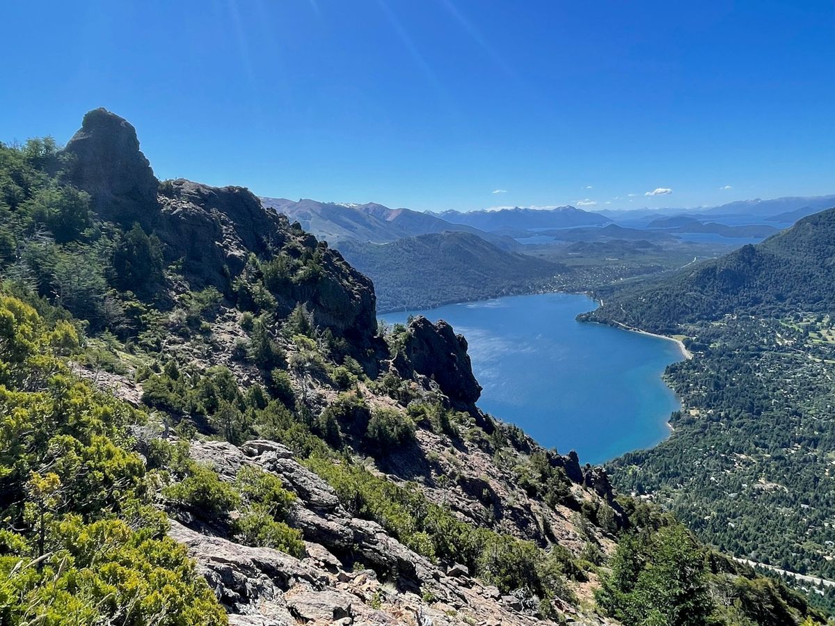 Lake nestled among lush green mountains in Bariloche, Patagonia