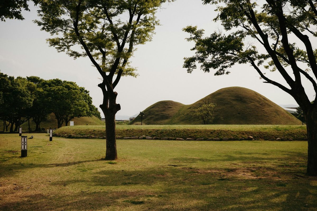 Ancient royal tumuli burial mounds in a green park in Gyeongju