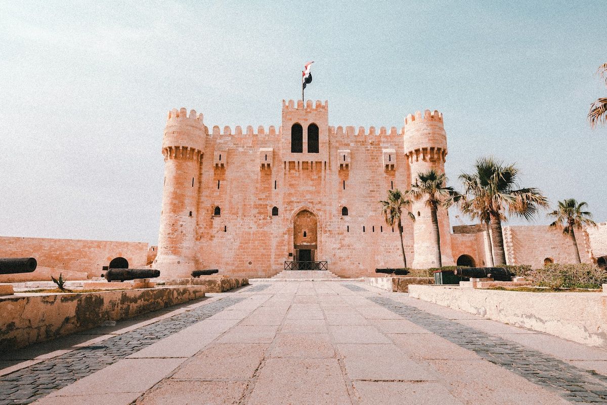 Qaitbay Citadel fortress with flag Alexandria Egypt