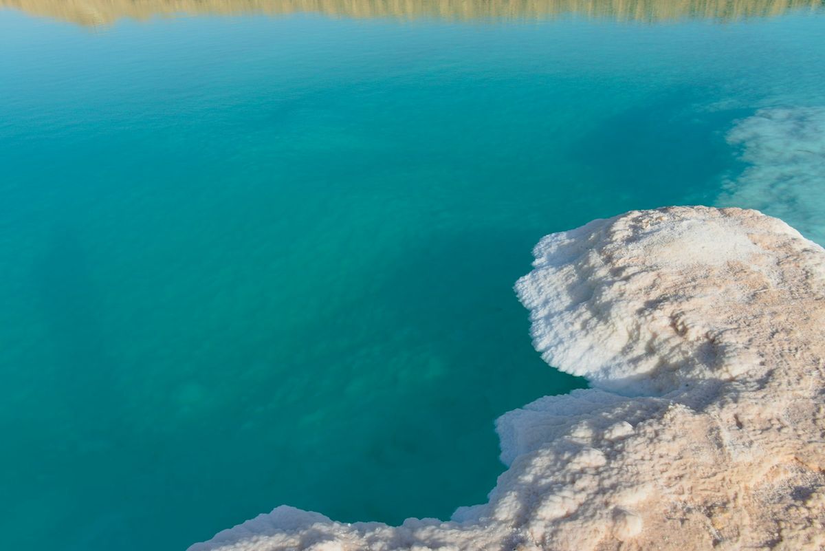 Turquoise salt lake near Siwa Oasis in the Egyptian desert