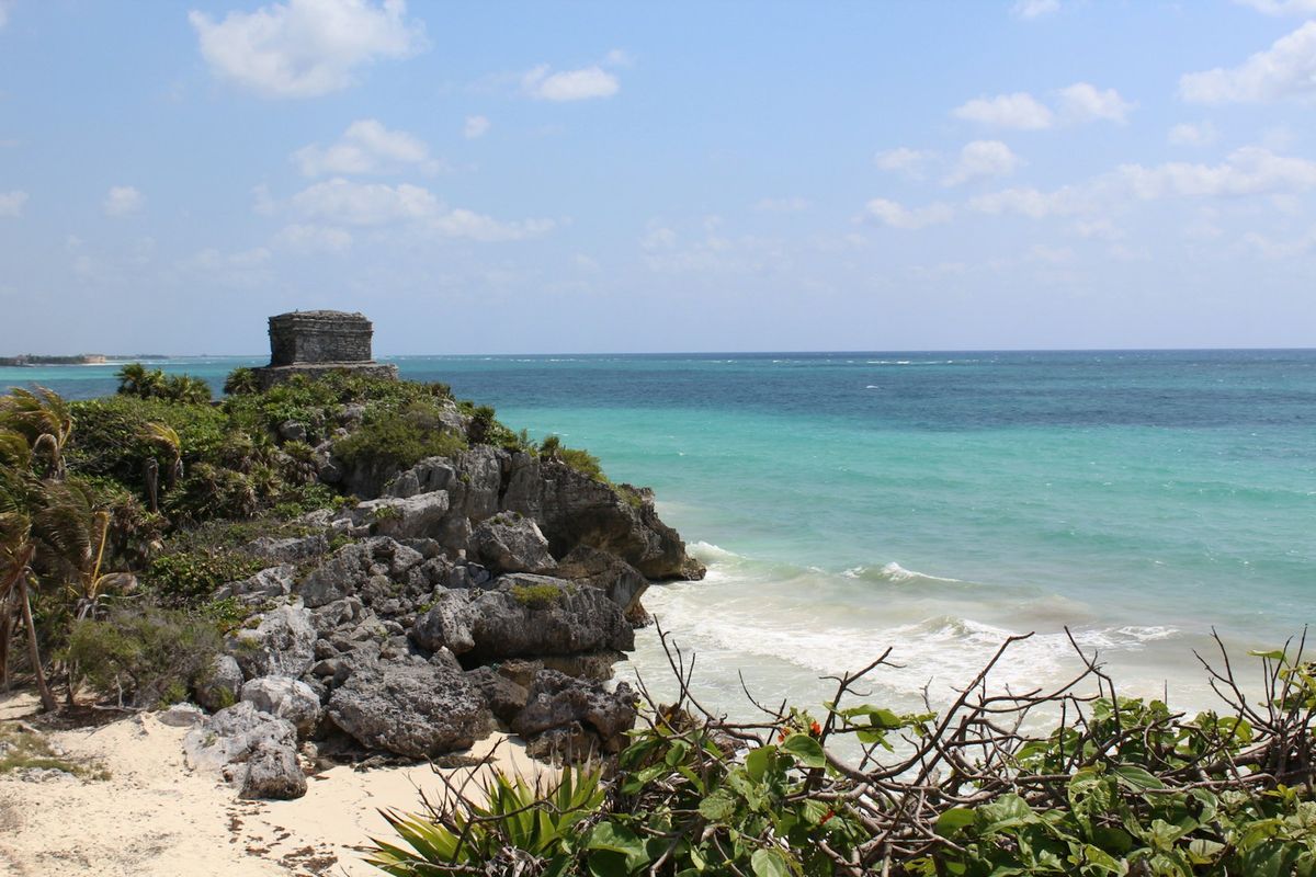 The Tulum ruins perched on a cliff above the Caribbean beach, Mexico