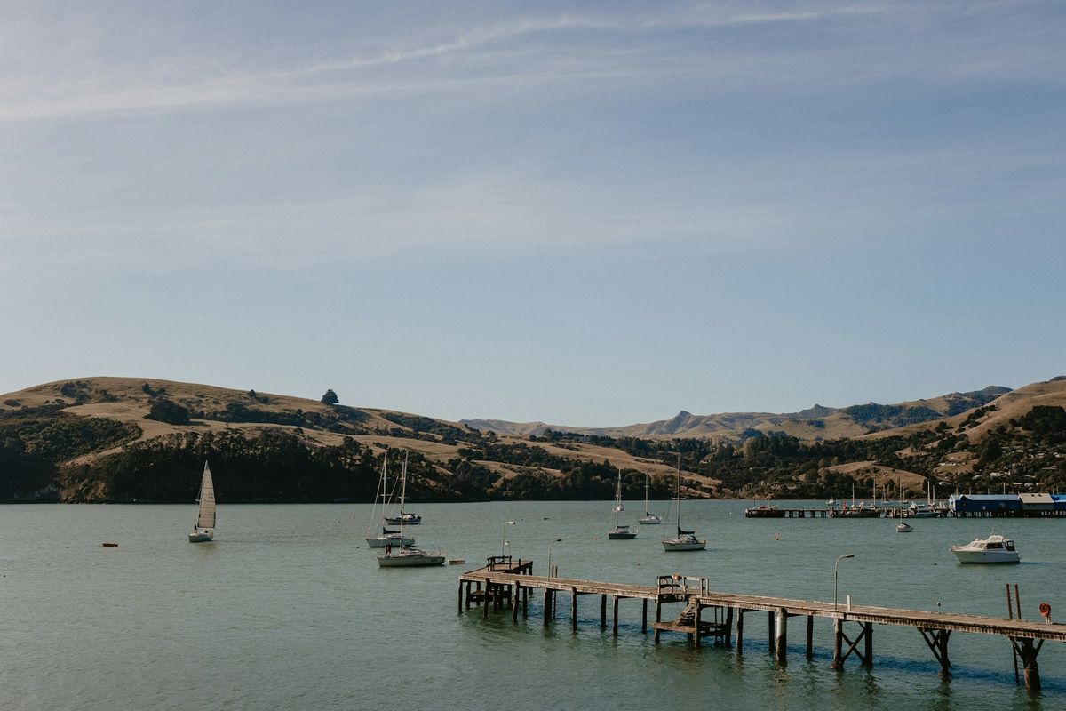 Boats moored in the harbour at Akaroa, New Zealand