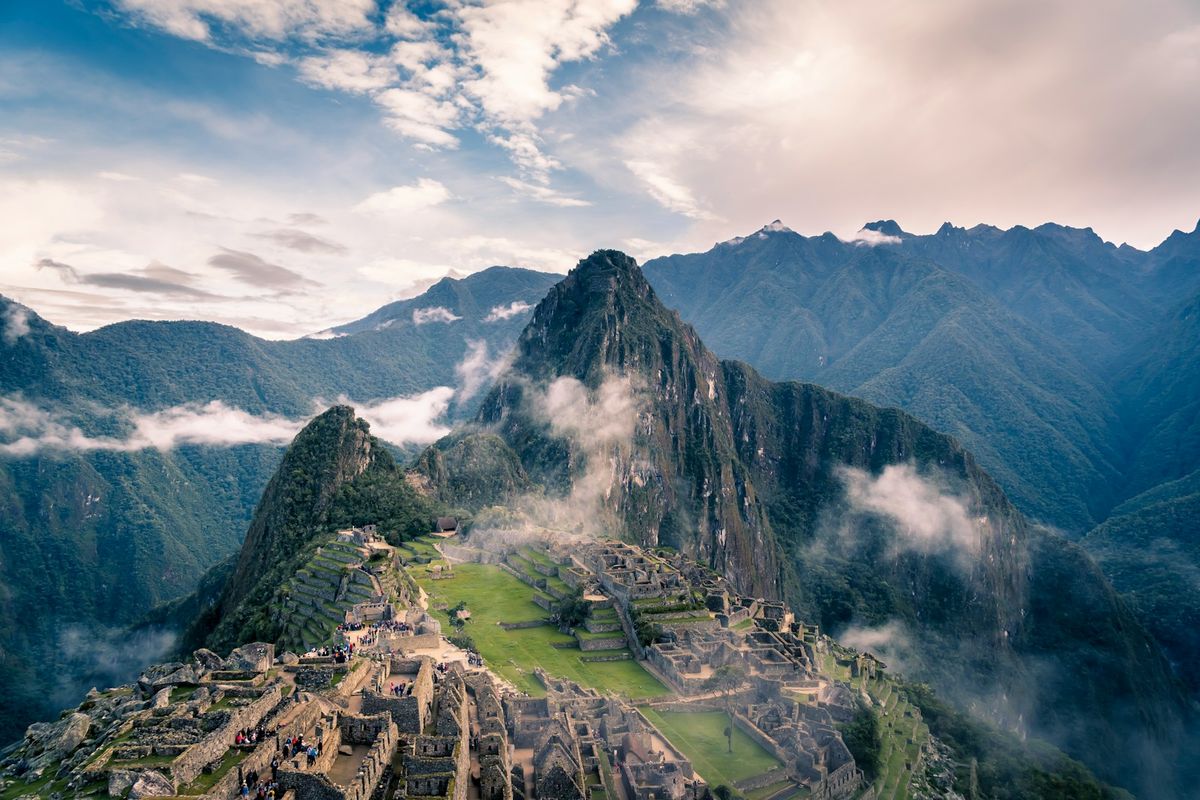 Machu Picchu ancient ruins among misty mountain peaks
