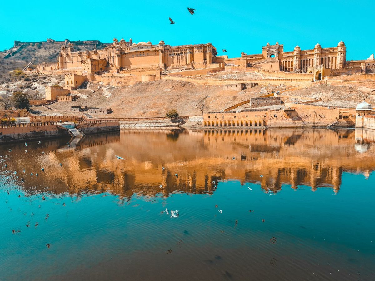 Stunning reflection of Amber Fort in the lake at Jaipur