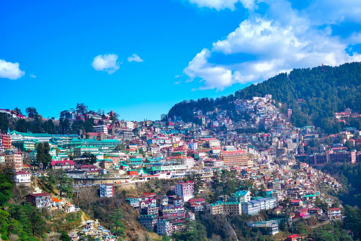 Urban settlement of Shimla nestled against Himalayan mountains
