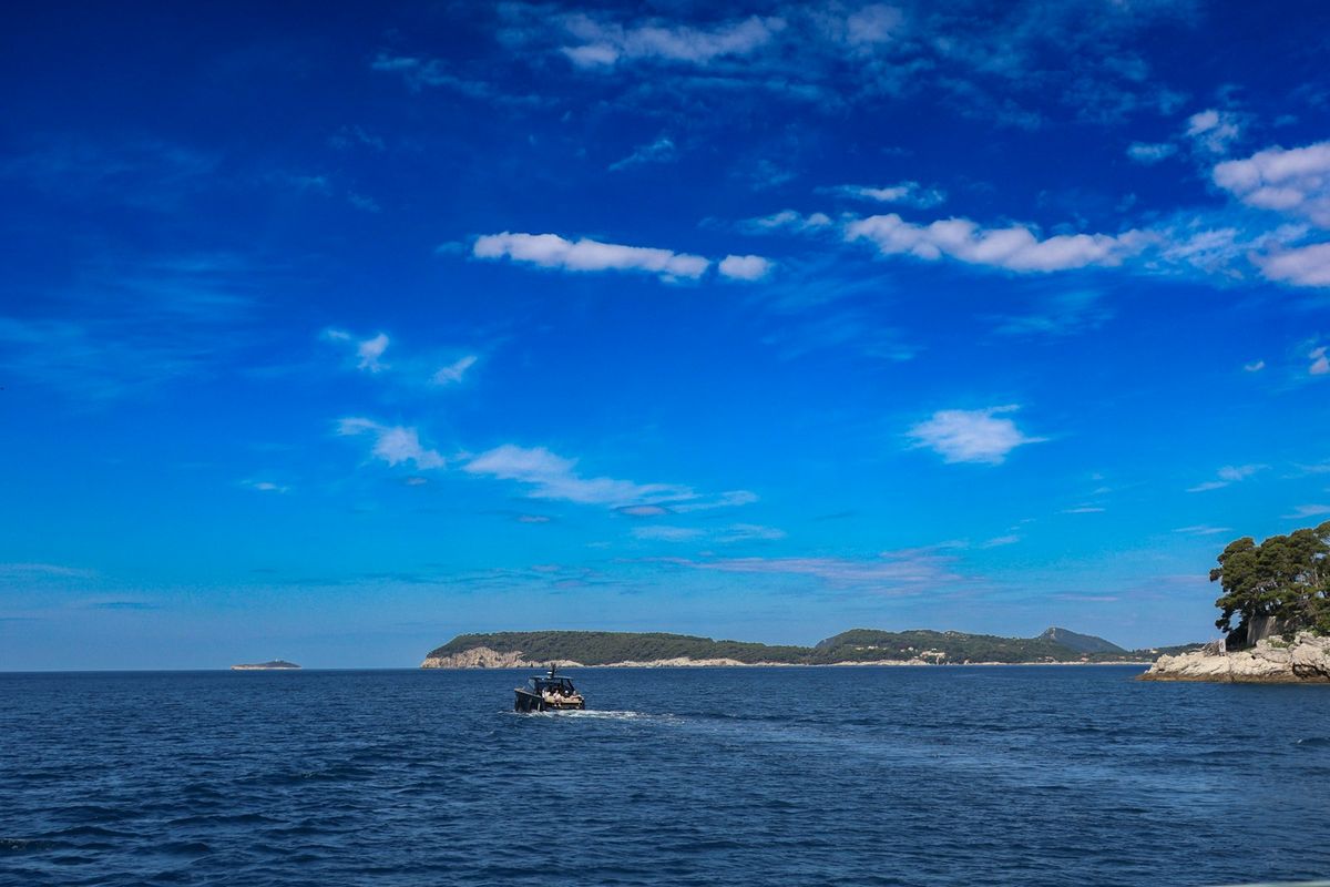 Boat traveling on the Adriatic Sea near one of the Elaphiti Islands