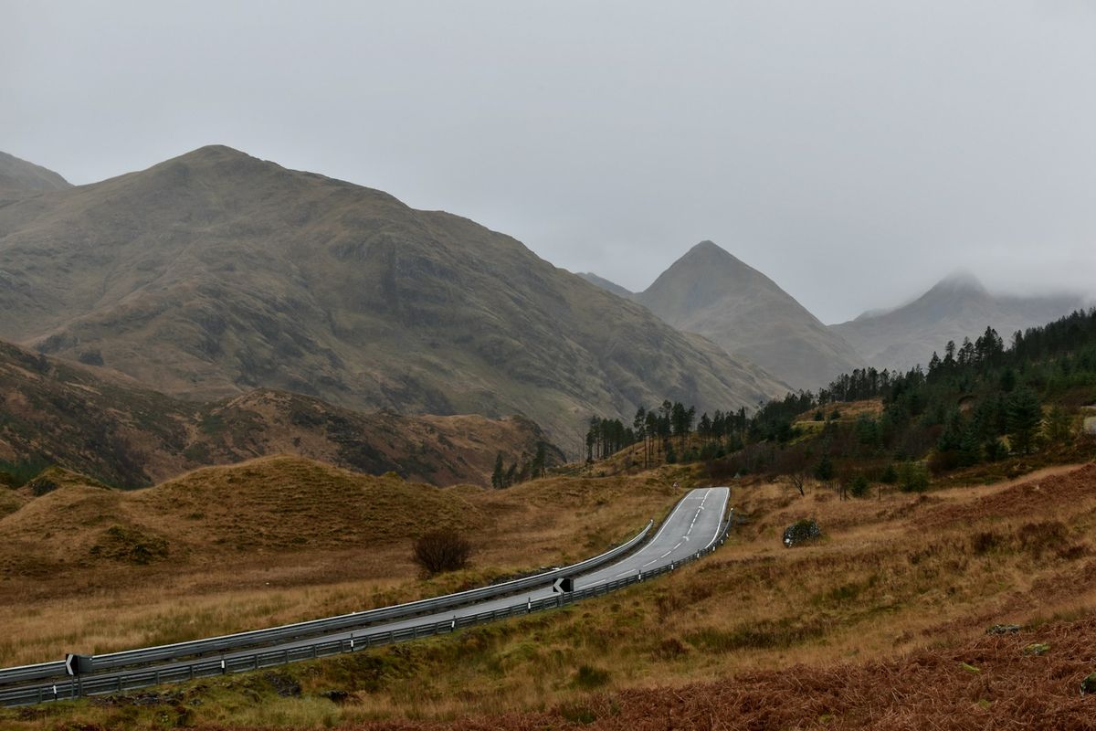 Winding road through the Scottish Highlands valley