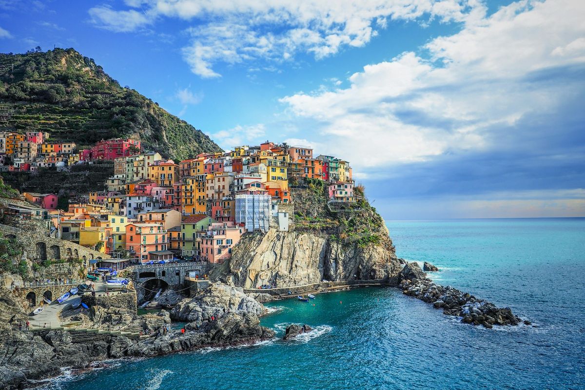 Colourful houses on the mountainside above the sea, Cinque Terre, Italy