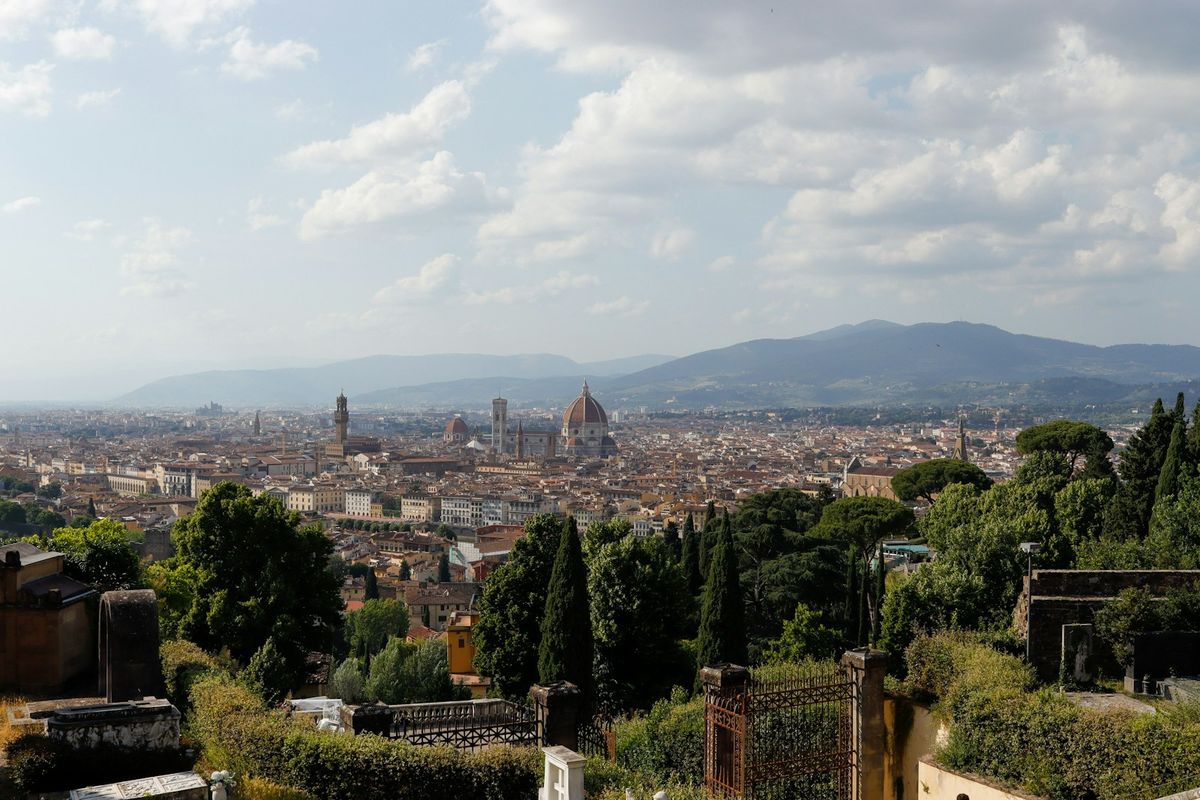 Panoramic view of Florence cityscape with rolling hills