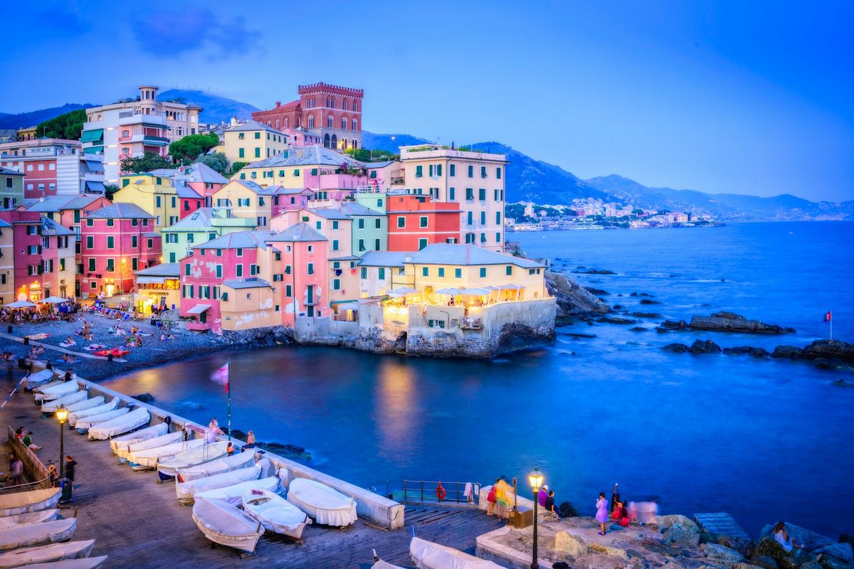Colorful Genoa harbor buildings at dusk