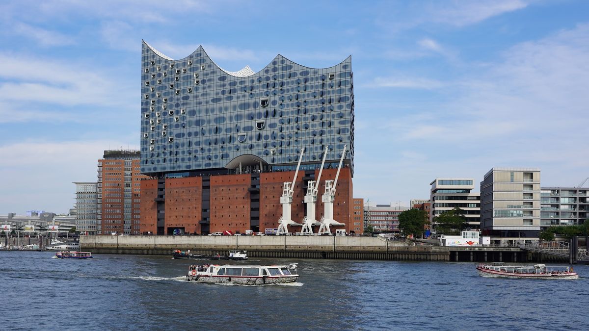 Elbphilharmonie concert hall and boats on the Elbe river in Hamburg
