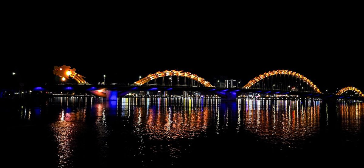 The Dragon Bridge lit up at night in Da Nang