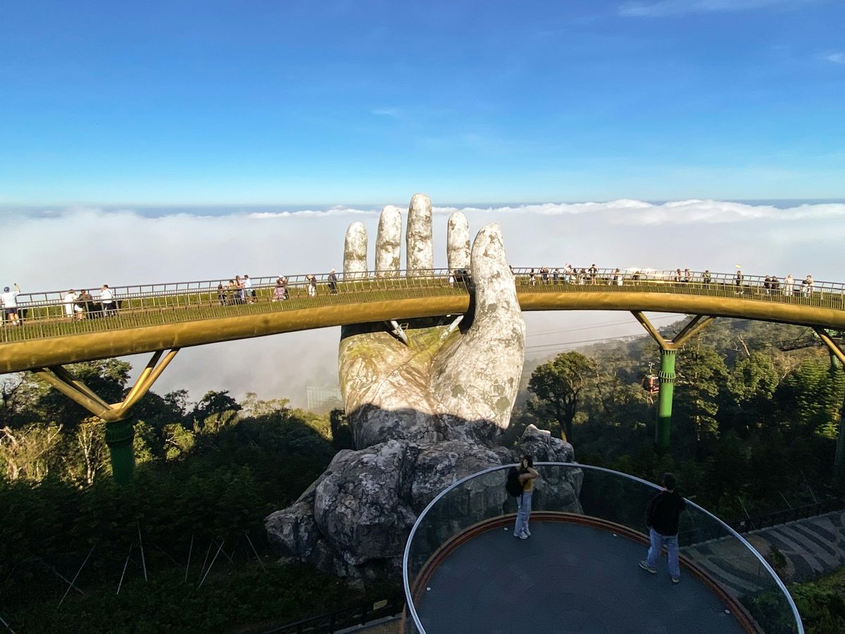 The Golden Bridge held by giant stone hands at Ba Na Hills near Danang