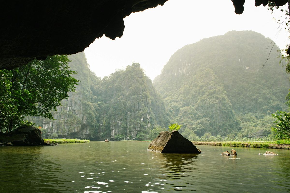 Limestone karsts and river at Trang An, Ninh Binh, Vietnam