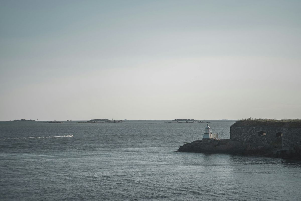 Historic fortification structure on Suomenlinna island surrounded by sea