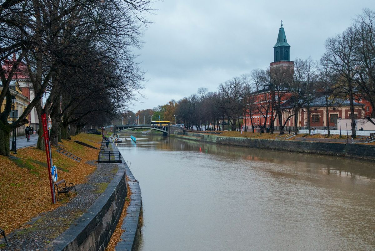 Turku river cityscape with cathedral clock tower Finland
