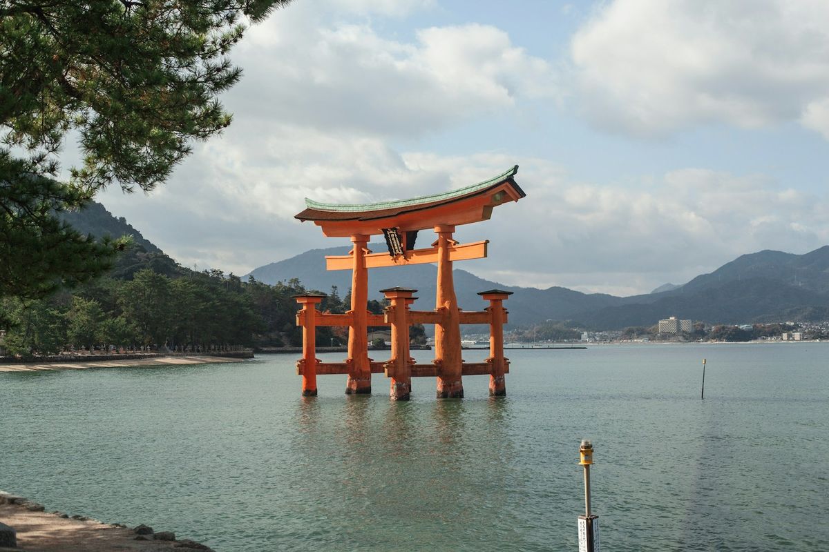 Itsukushima floating torii gate seen from Miyajima island shore