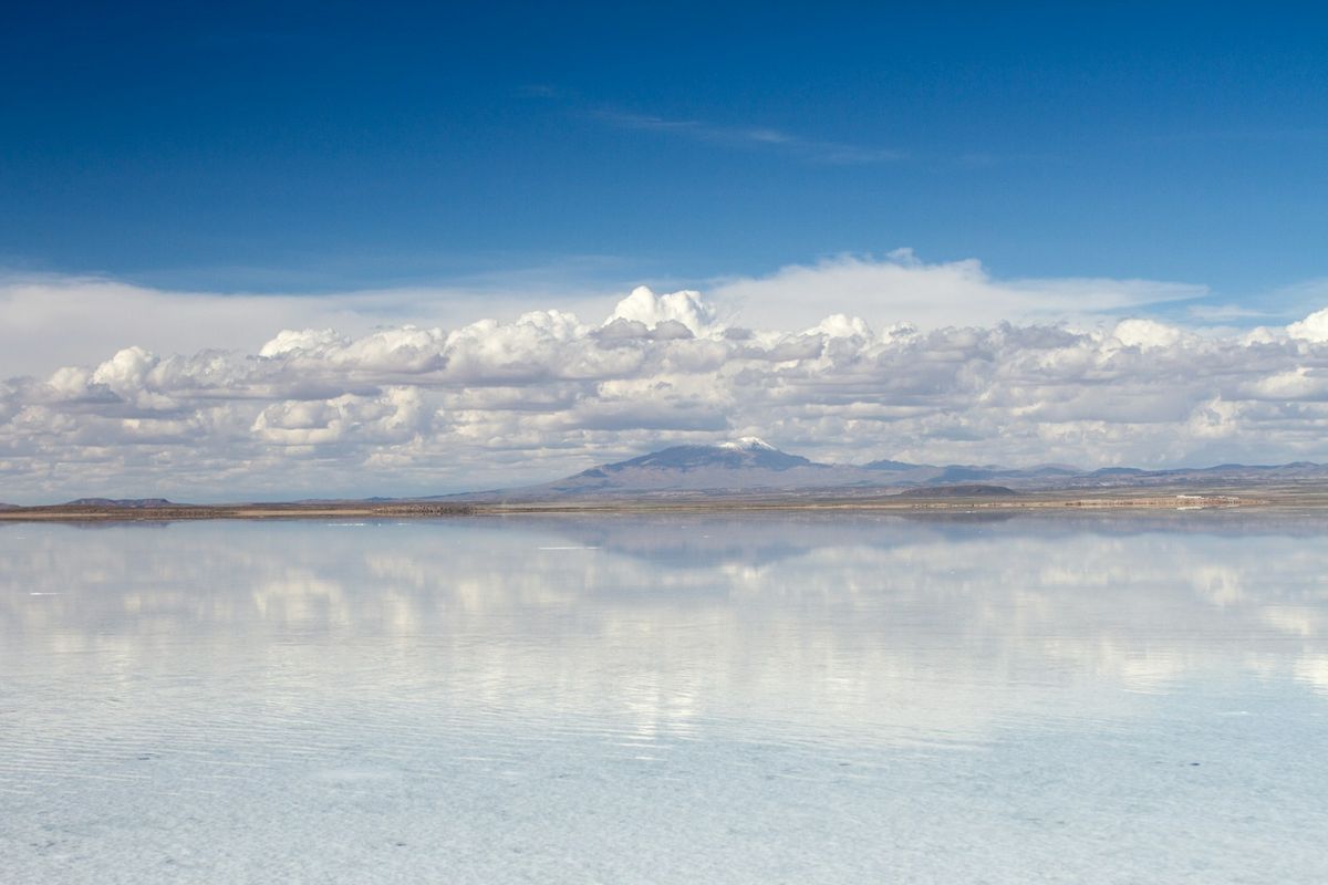 Vast Uyuni salt flats reflecting blue sky and clouds
