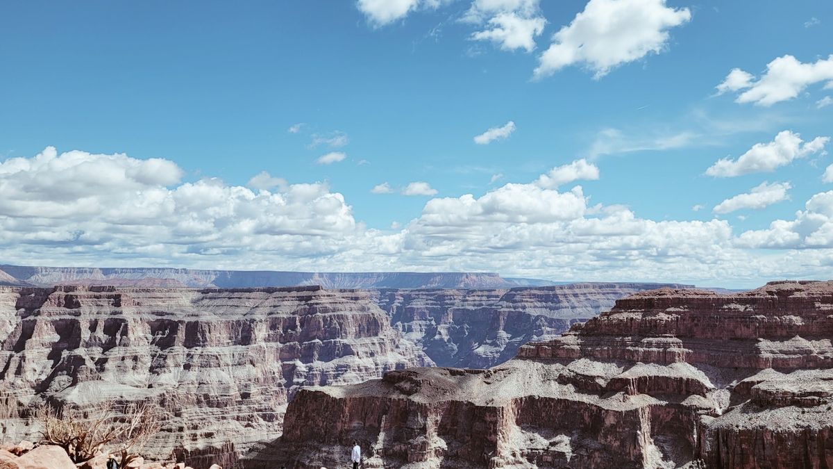 The Grand Canyon under a bright, cloudy sky