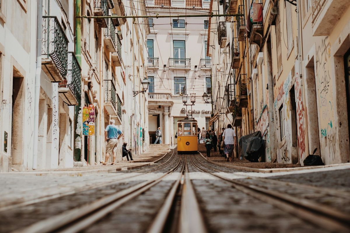 Train passing between buildings in Portugal