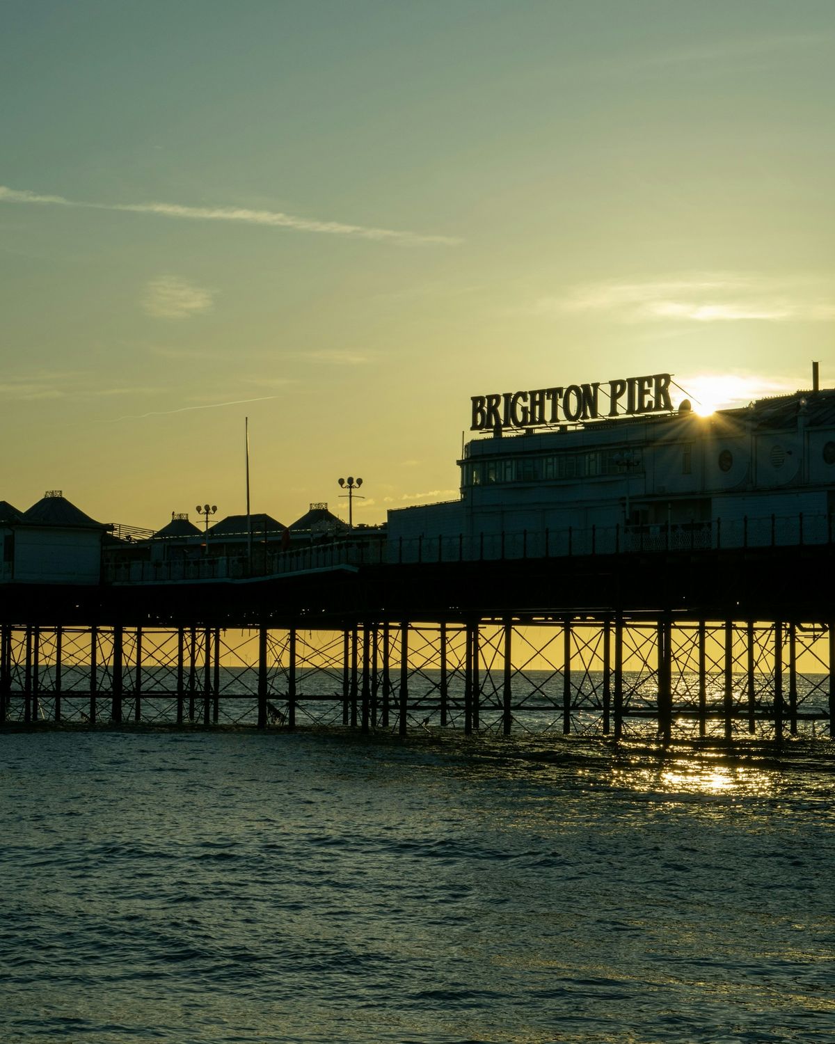 Brighton Palace Pier at sunrise over the sea