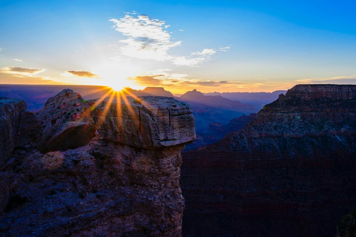 Sunrise light over the Grand Canyon's layered rock walls