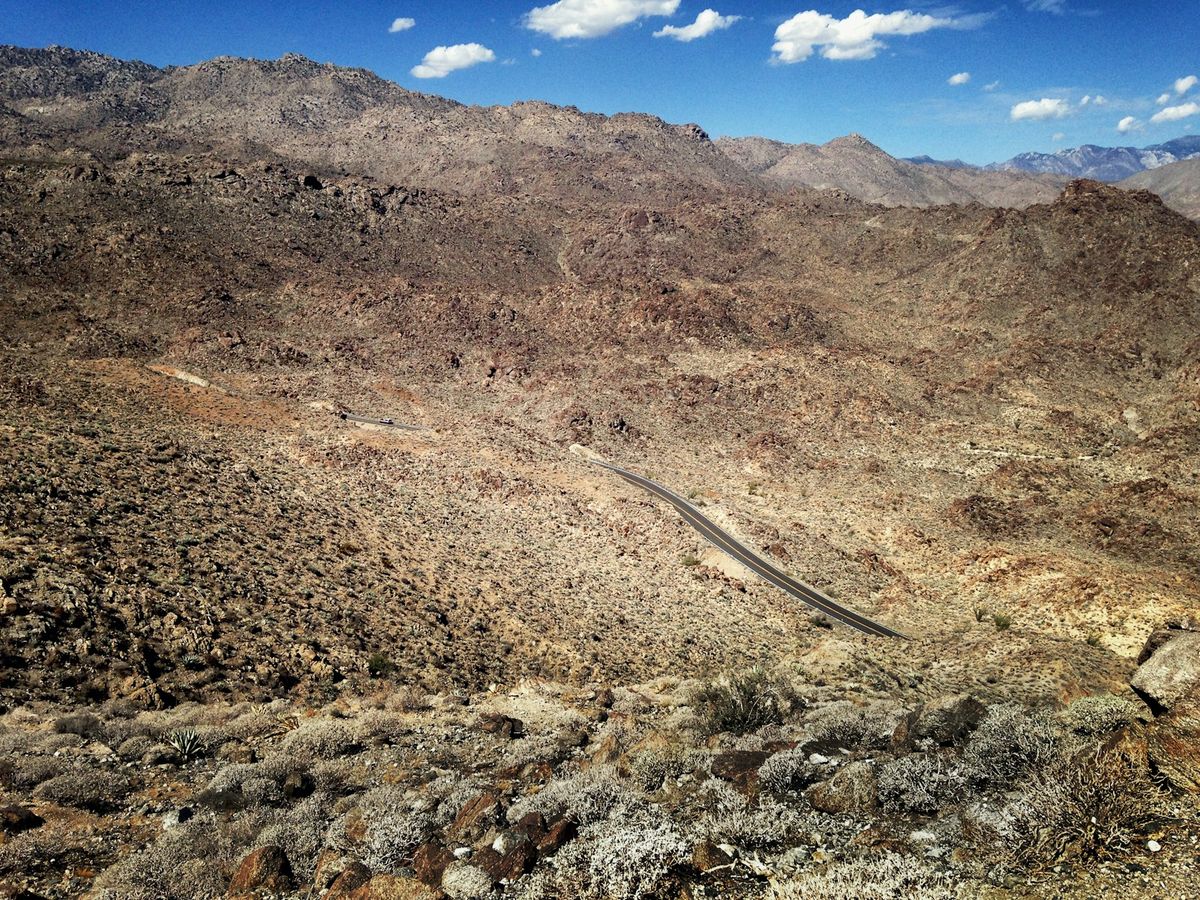 Aerial view of a winding desert mountain road near Palm Springs