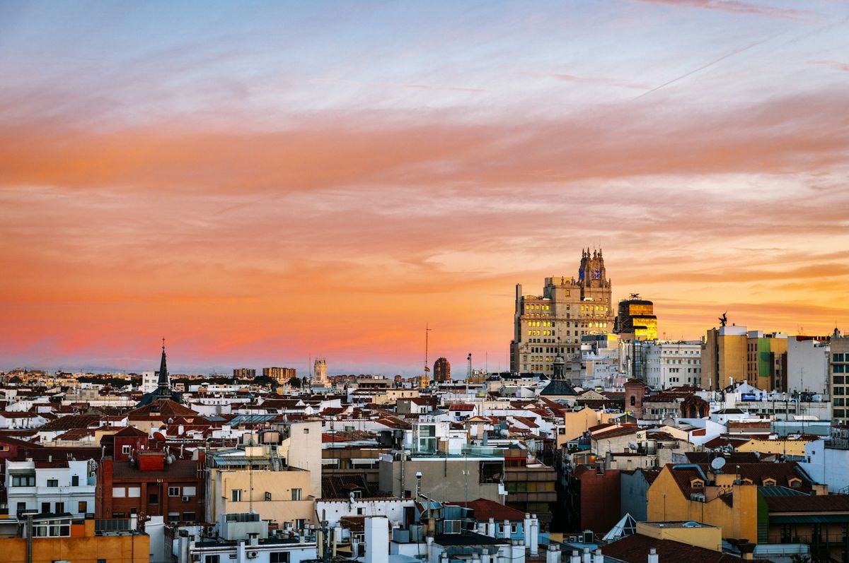 Madrid skyline with tall buildings at sunset