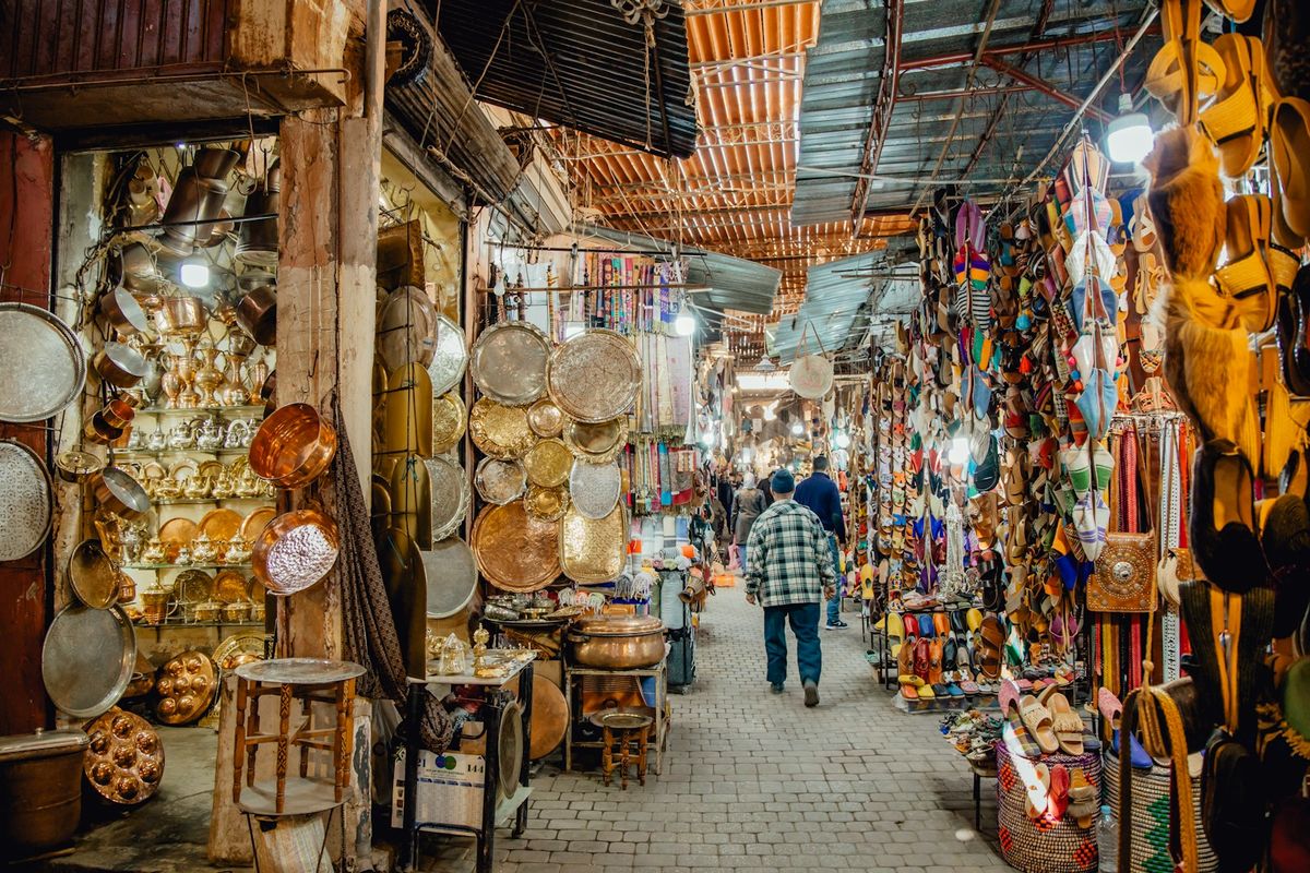Bustling Marrakech marketplace filled with goods and shoppers