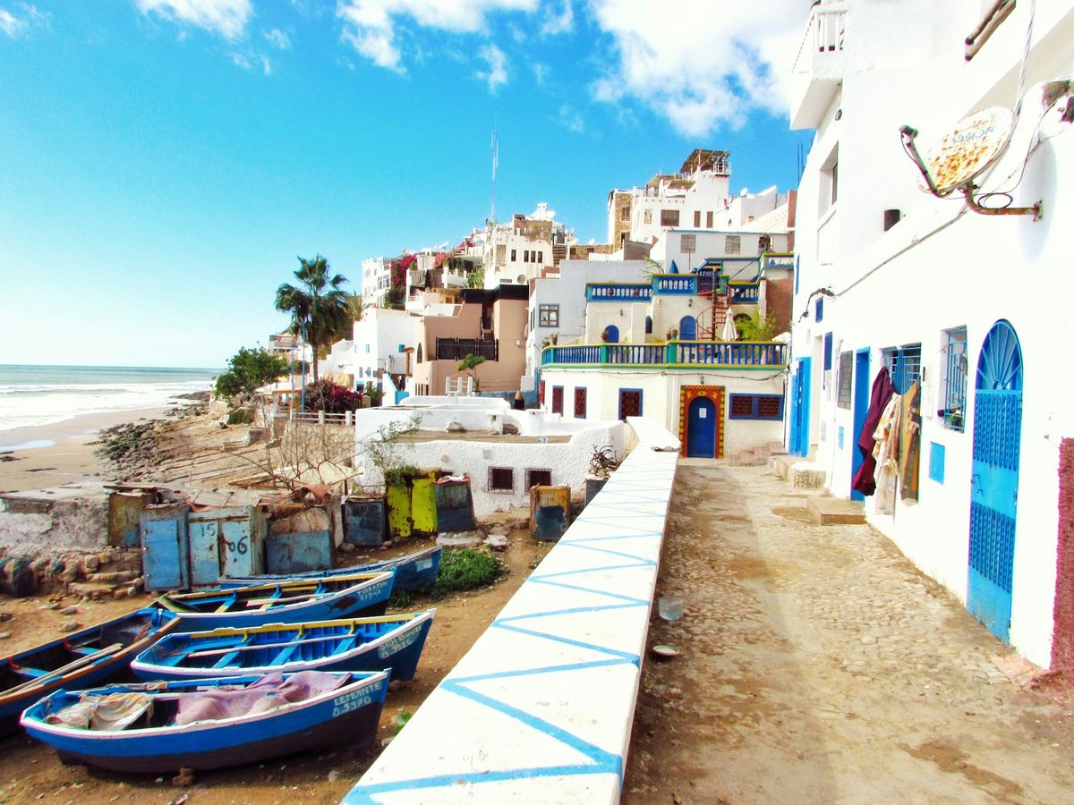 Boats docked near the harbor houses of Essaouira, Morocco
