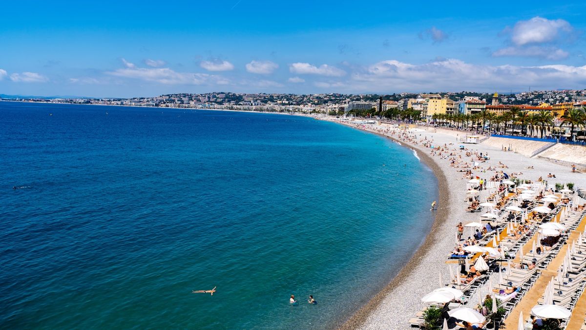 Nice beach with ocean and city skyline