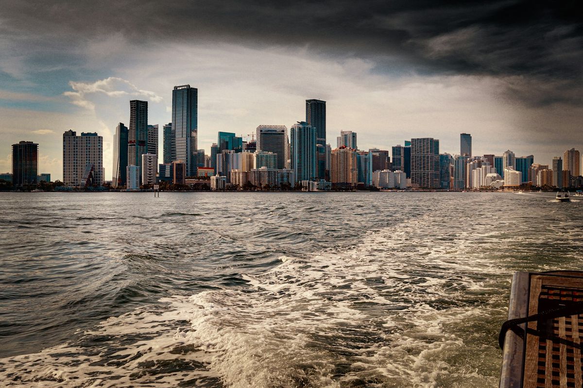 Miami city skyline across the sea during daytime