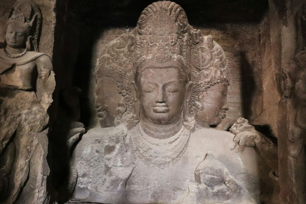 Ancient carved stone sculpture inside the Elephanta Caves near Mumbai