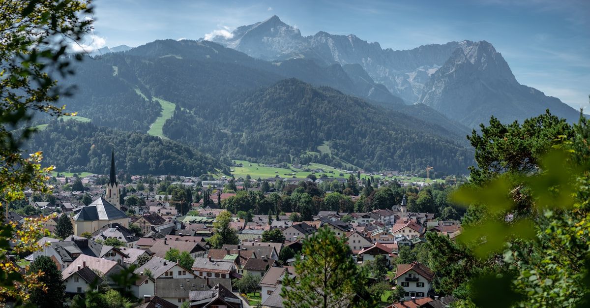 Aerial view of a Bavarian town with the Alps in the background